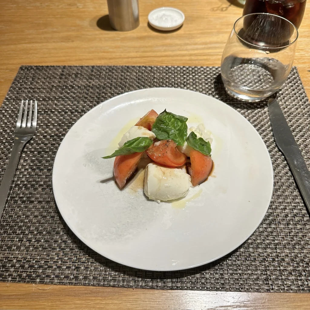Tomatoes and mozzarella appetizer at Qantas First Class Lounge LAX