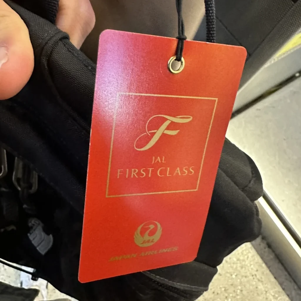 Japan Airlines first class passengers receive an exclusive bag tag when checking in