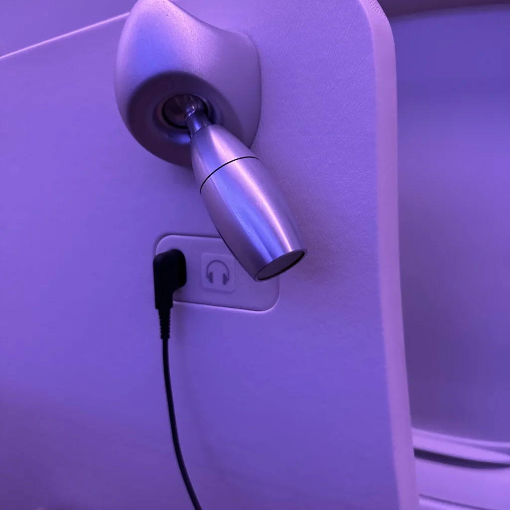 Japan Airlines first class seats have two mini seat lights on the left and right that you can turn on