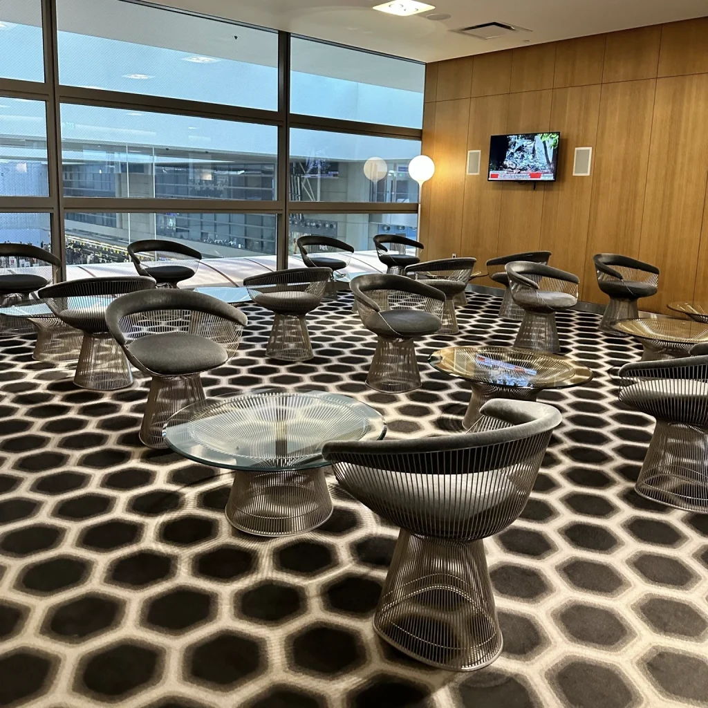More seating with small coffee tables at Qantas First Class Lounge LAX