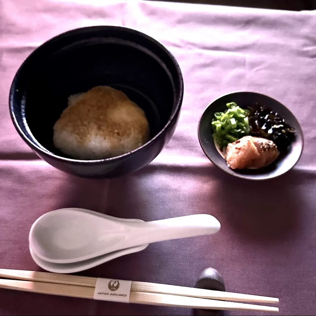 Japan Airlines first class anytime menu item of steamed rice with spicy cod roe in Japanese dashi broth