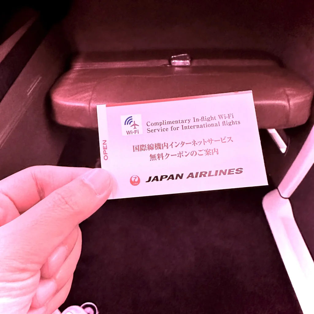 Japan Airlines First class passengers receive a Wifi card explaining the password and hot to connect for free