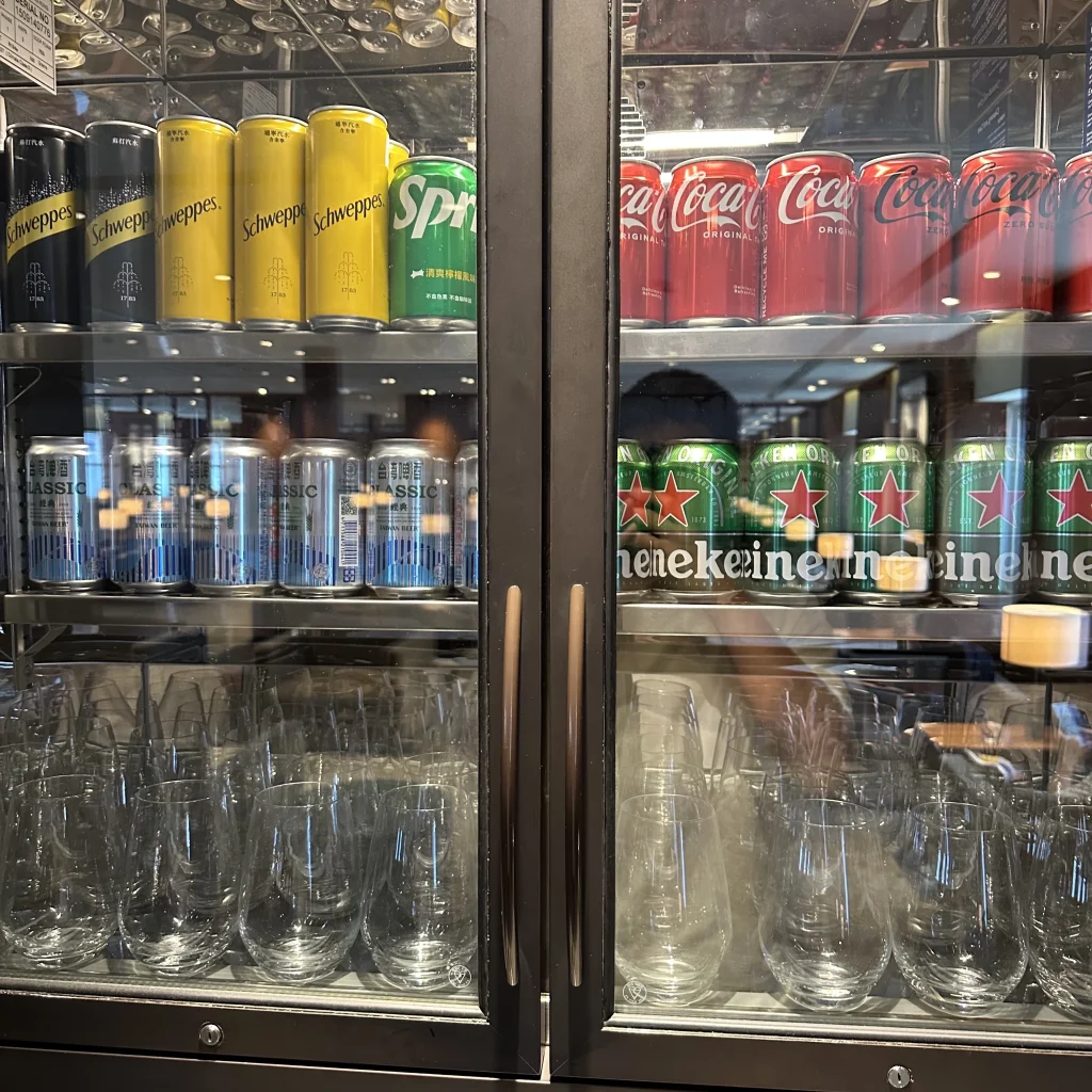 The Cathay Pacific Business Class Lounge at Taoyuan International Airport has a drink cabinet full of beer and soft drinks