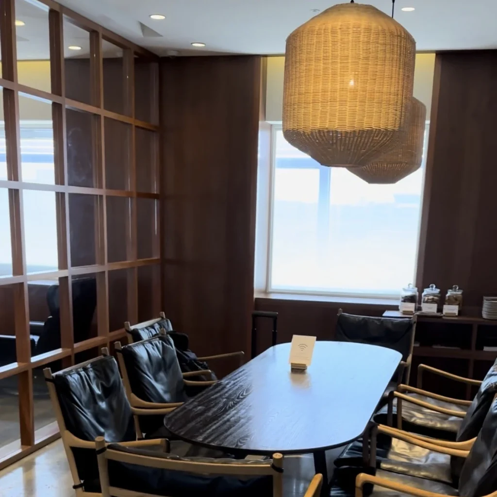 The Cathay Pacific Business Class Lounge at Taoyuan International Airport has multiple dining tables and chairs