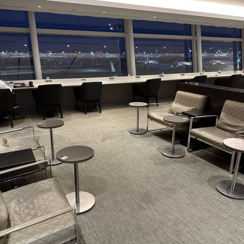 Lounge Seating and Charging Ports in Japan Airlines First Class Lounge