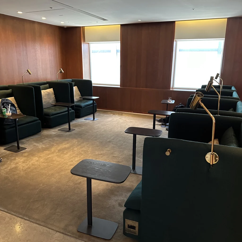 The Cathay Pacific Business Class Lounge at Taoyuan International Airport features privacy seats with individual lights and tables