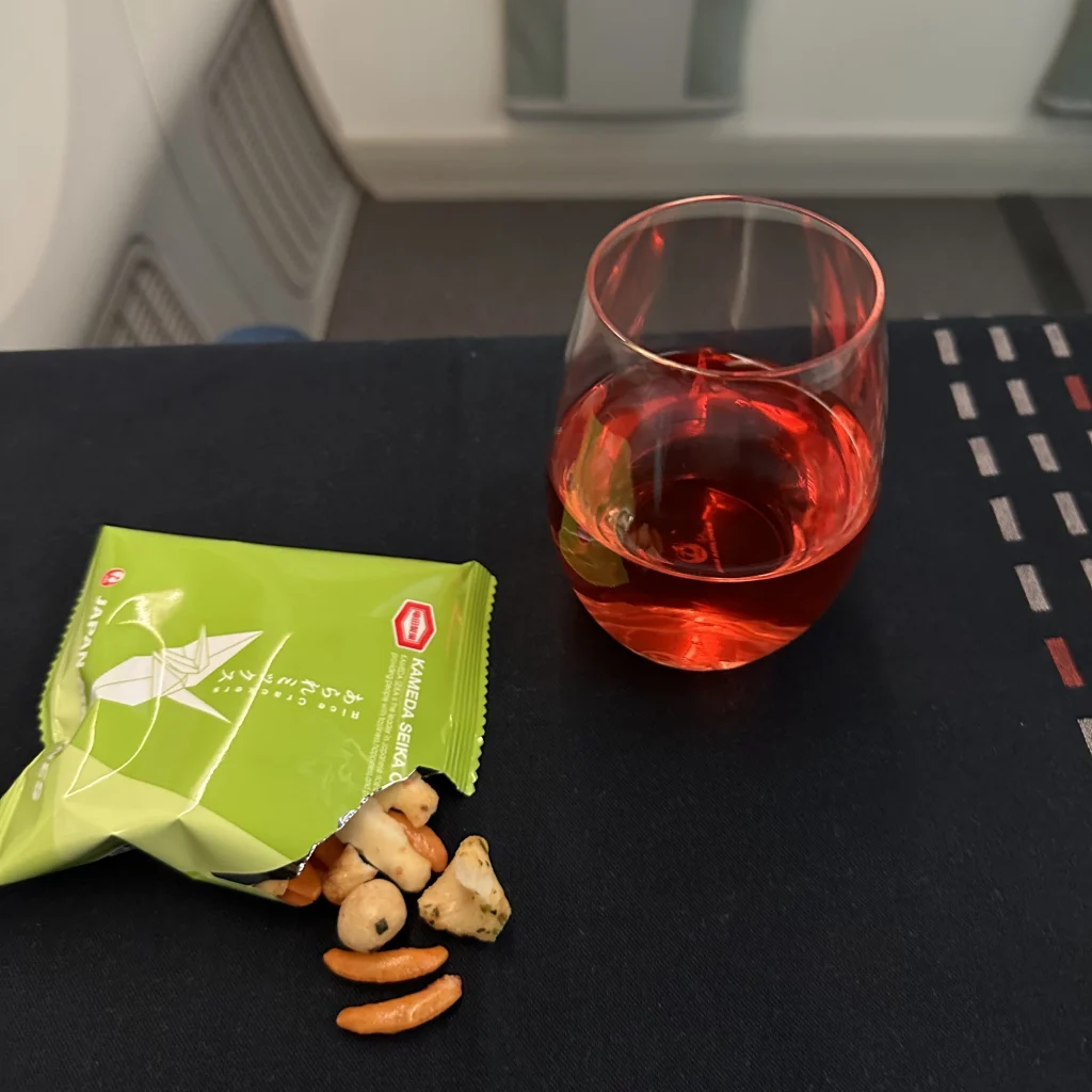 Business class passengers get rice crackers and their choice of drink