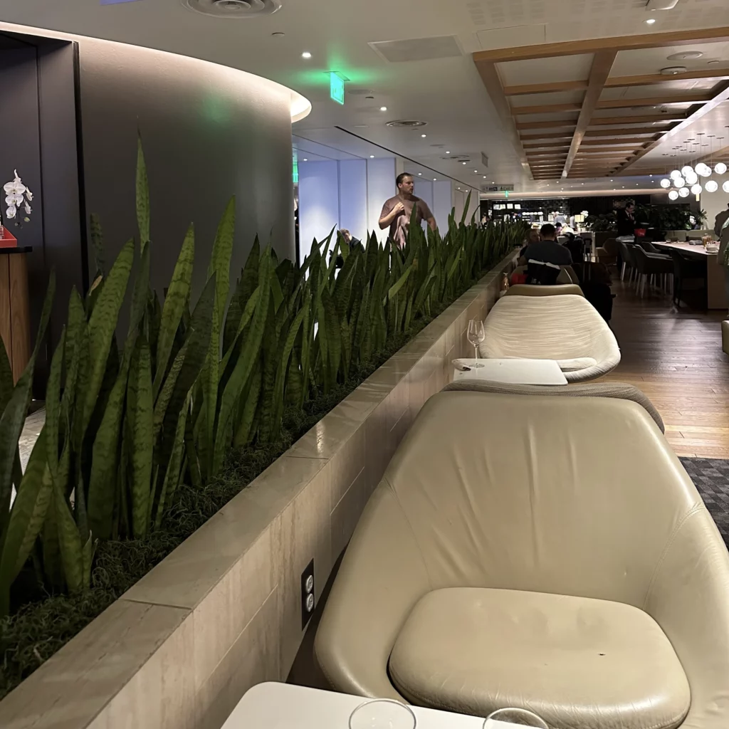 The OneWorld Lounge at LAX has lots of seating options and plants for decoration