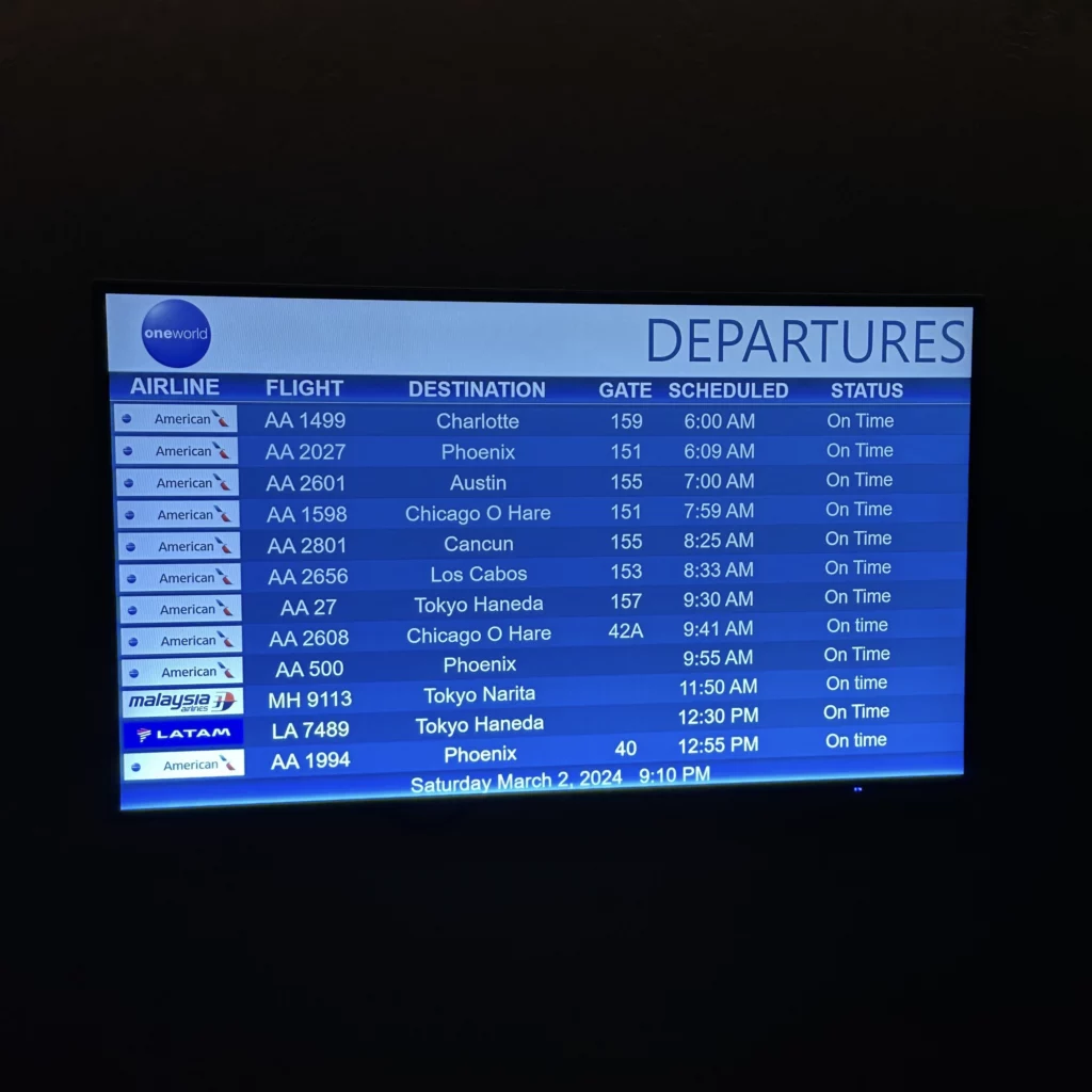 The OneWorld Lounge at LAX has lots of TVs throughout the lounge displaying departure information