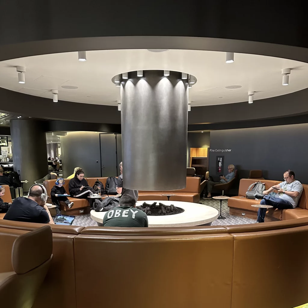 The OneWorld Lounge at LAX has a grand fireplace