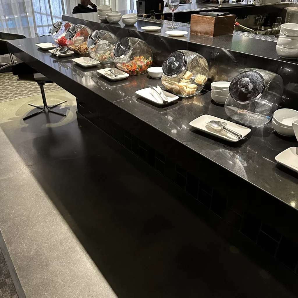 The OneWorld Lounge at LAX has more snacks behind the bar