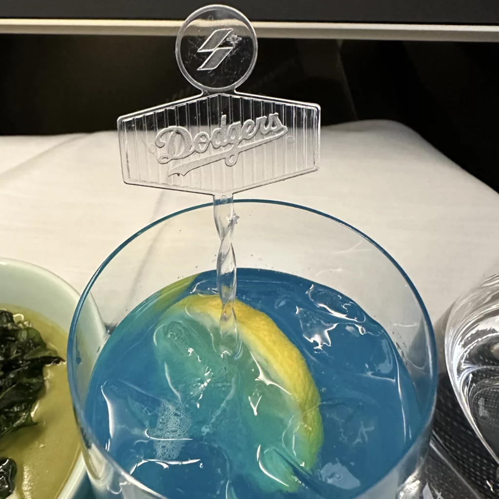 Starlux business class from Los Angeles to Taipei cocktails have Dodgers-branded stirrers