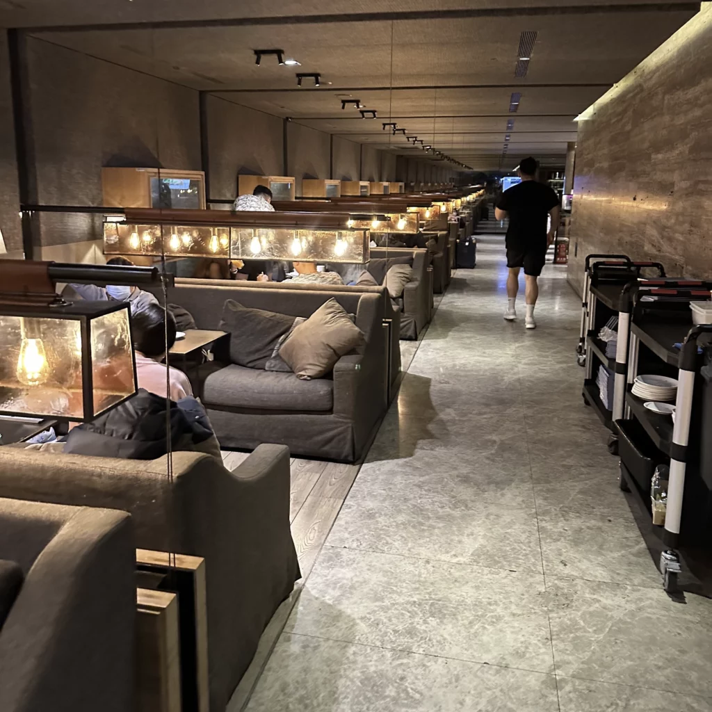 The China Airlines VIP Lounge in Terminal 1 of Taoyuan International Airport has rows of couches along the sides of the lounge