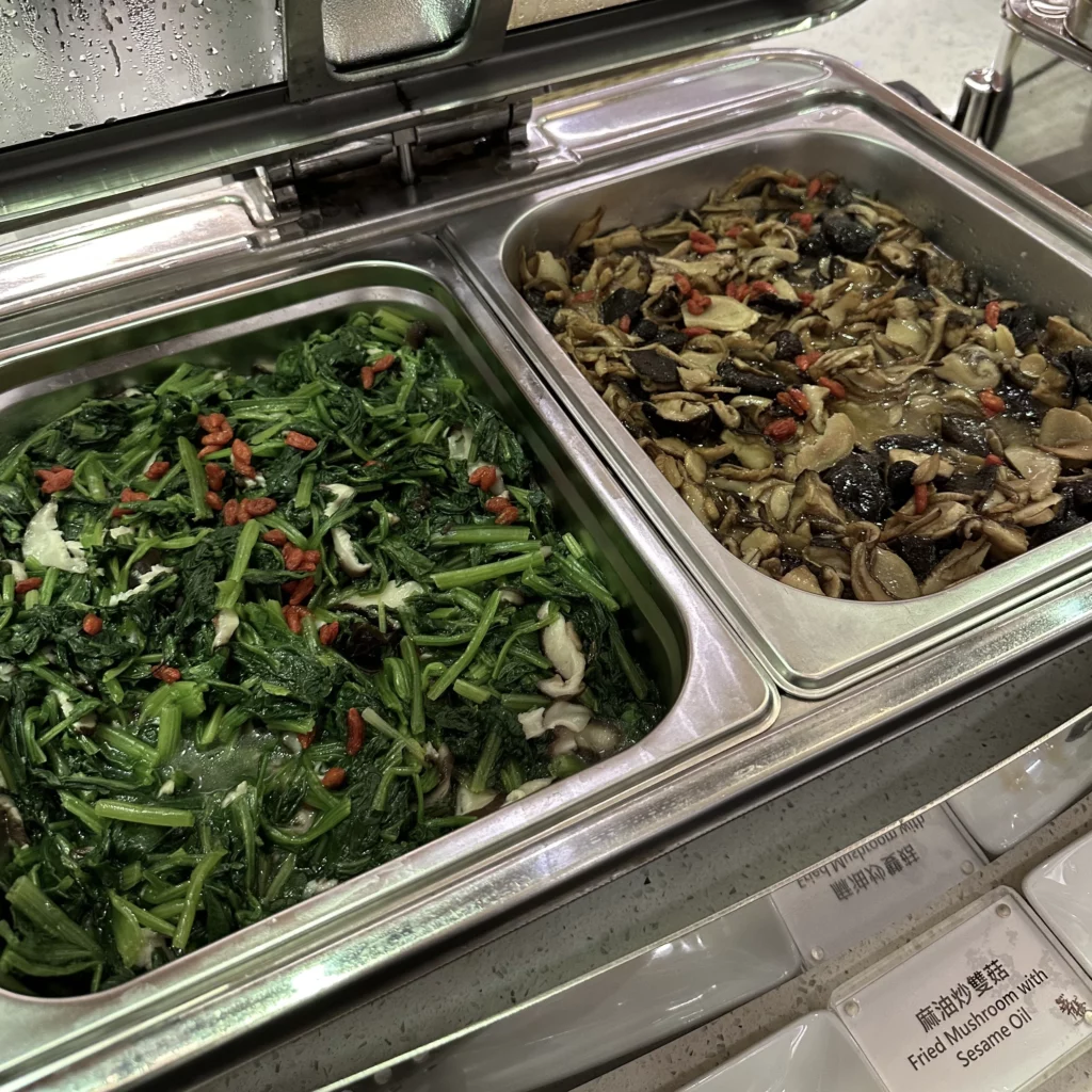 The China Airlines VIP Lounge in Terminal 2 of Taoyuan International Airport has Chinese style breakfast options like stir fried vegetables