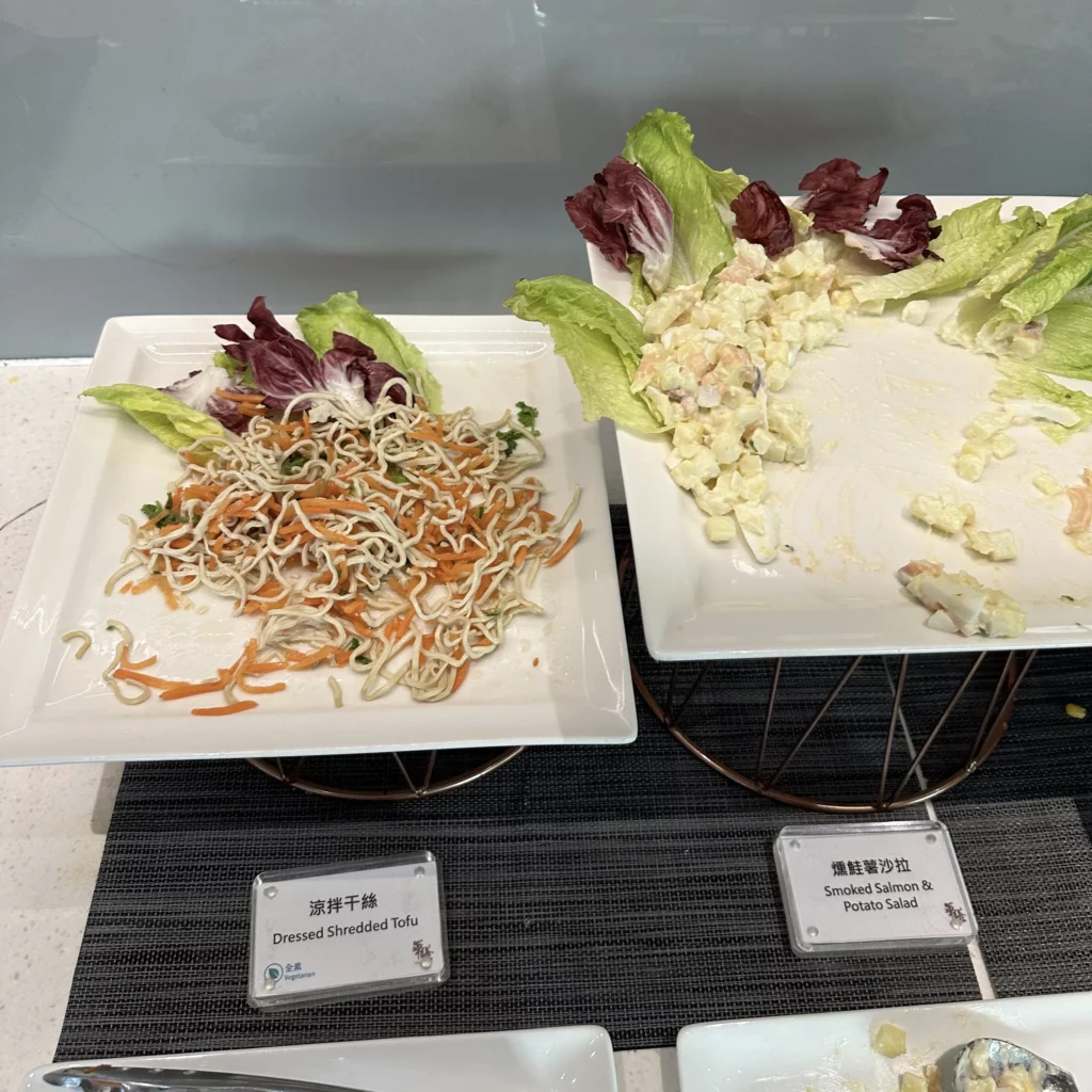 The China Airlines Dynasty Lounge has cold food options like shredded tofu and potato salad