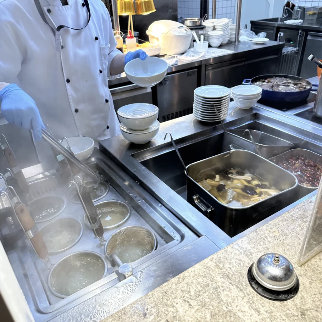 The Oriental Club Lounge at Taoyuan International Airport has a live food counter you can order fresh food from