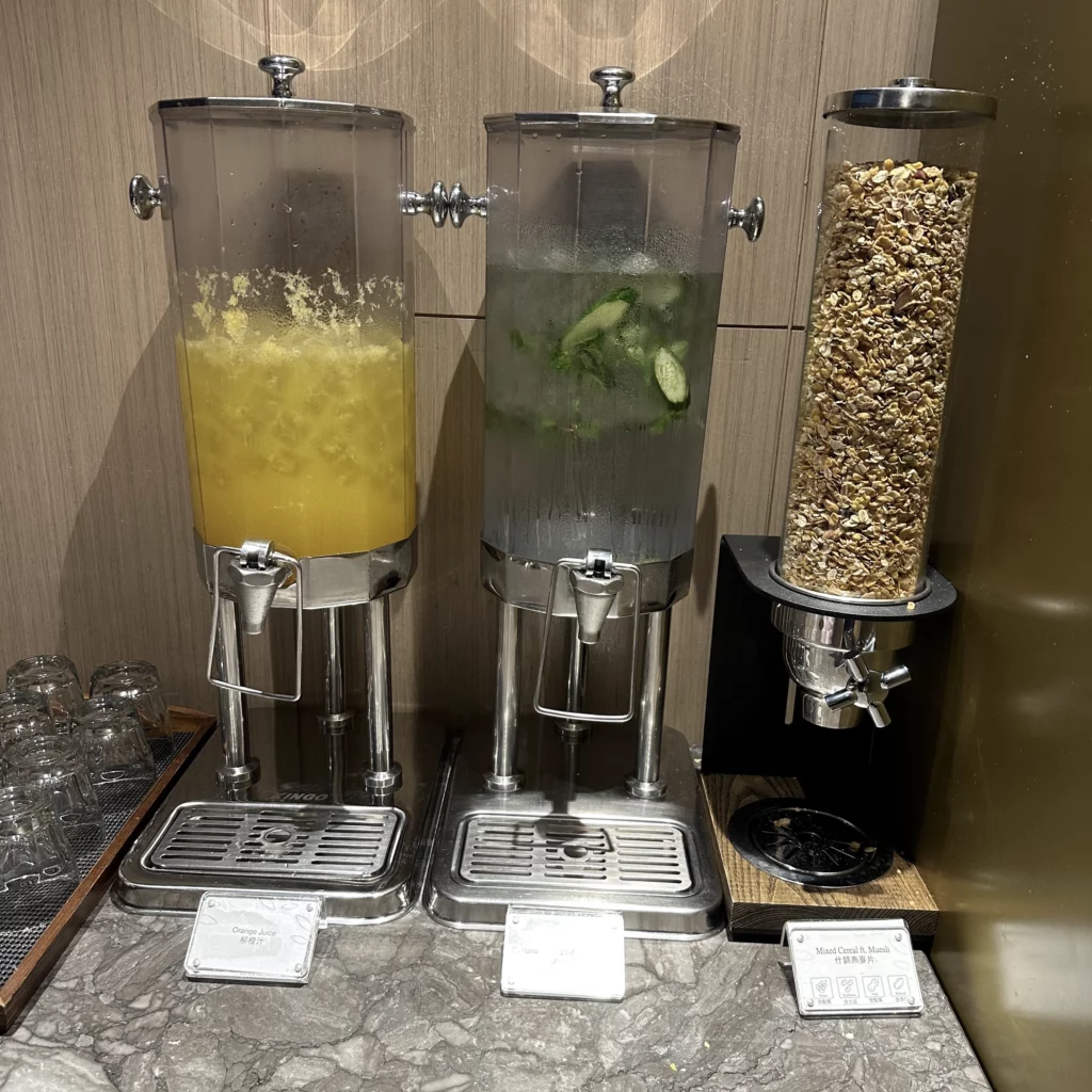 The Plaza Premium Lounge Zone A at Taoyuan International Airport in Taipei has several drink towers with flavored water and orange juice