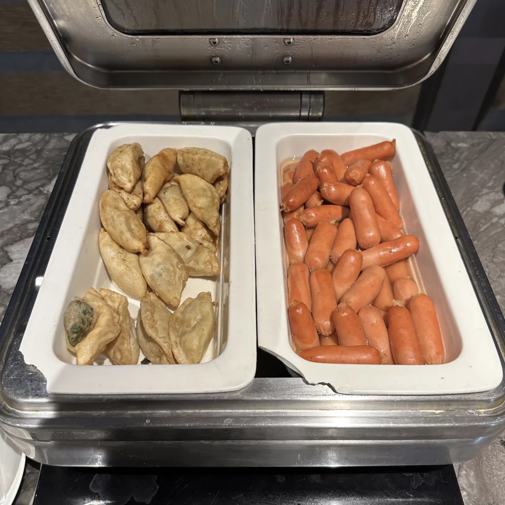 The Plaza Premium Lounge Zone A at Taoyuan International Airport in Taipei has lots of dining options like fried dumplings and mini hot dogs