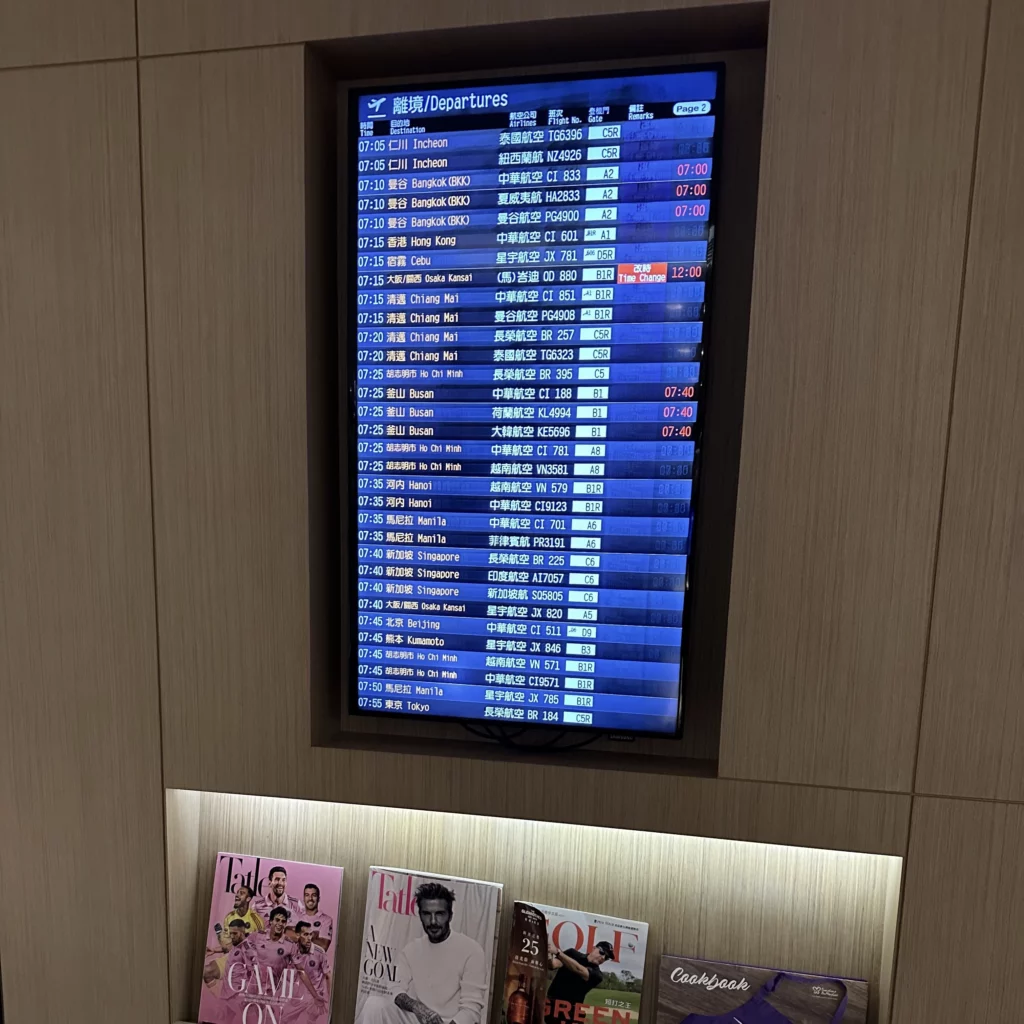 The Plaza Premium Lounge Zone A at Taoyuan International Airport in Taipei has some magazines and a departure board