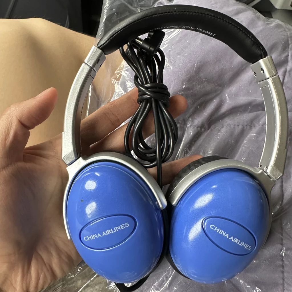 China Airlines A330-300 Business Class seats have China Airlines branded headphones