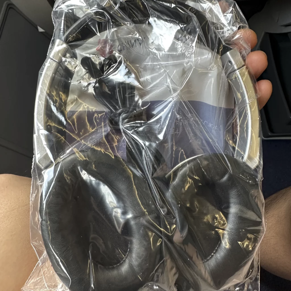 China Airlines A330-300 Business Class seats come with plastic wrapped headphones
