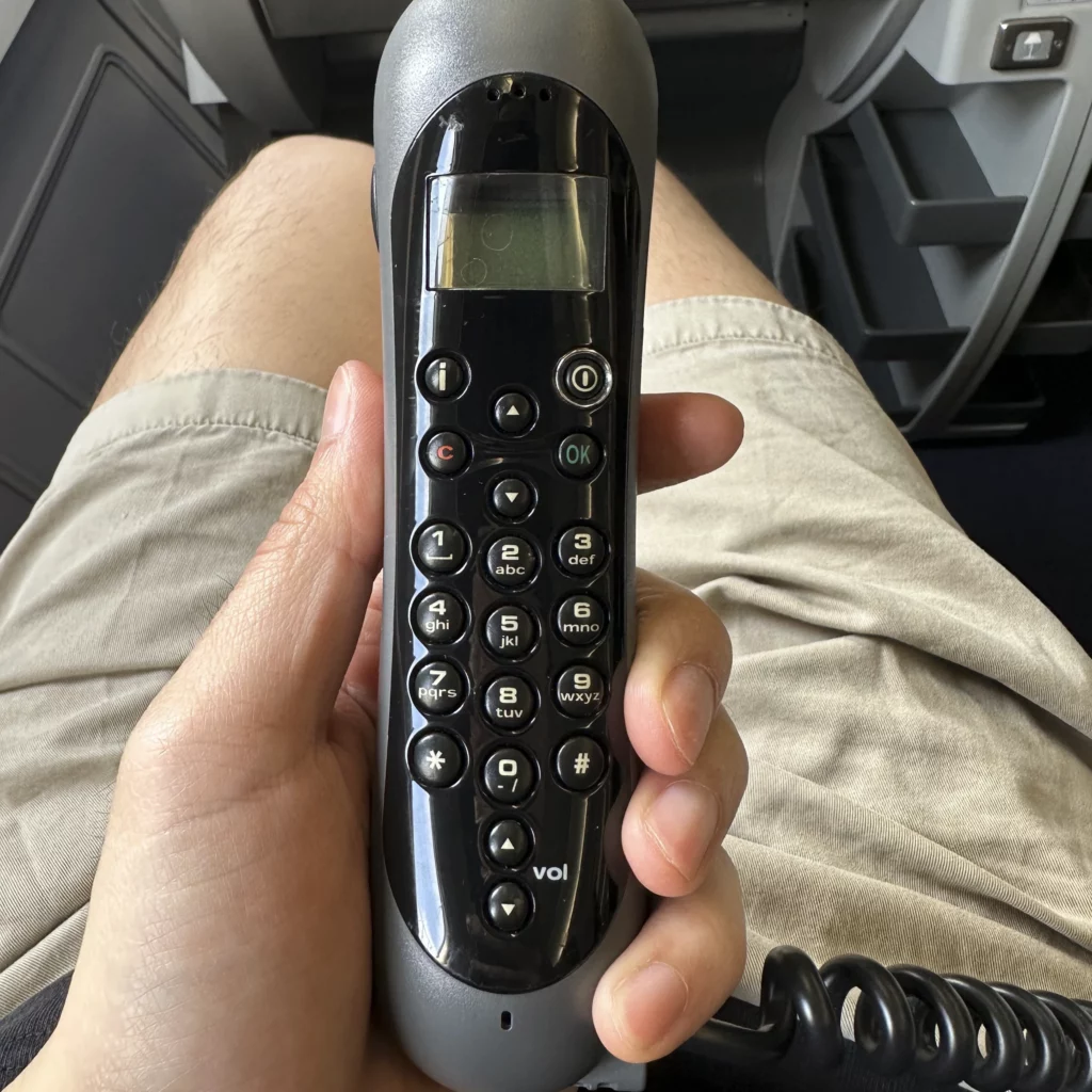 China Airlines A330-300 Business Class seats have a phone built into the back of the TV remote
