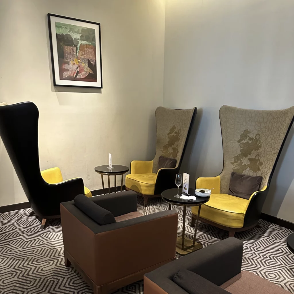 The Singapore Airlines SilverKris Lounge in Bangkok Suvarnabhumi Airport has some modern lounge chairs with tall seating backs
