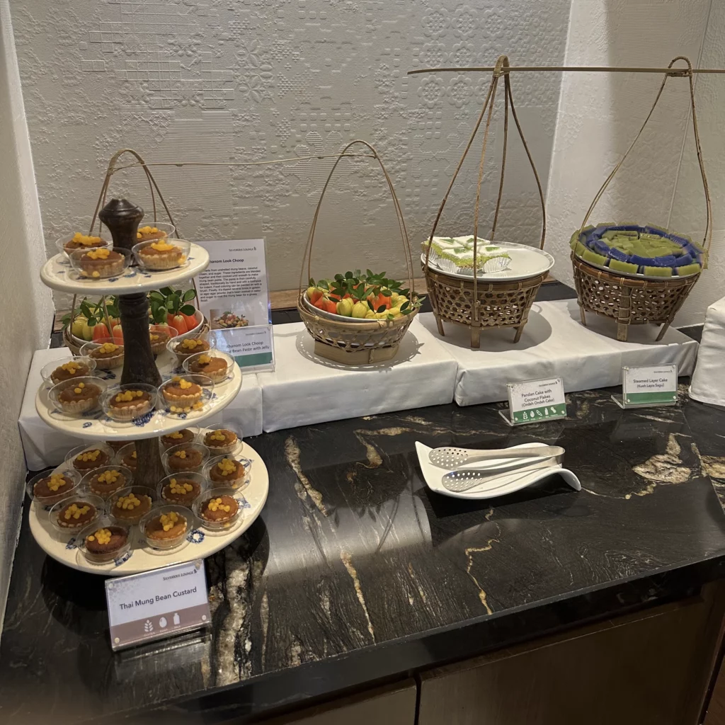 The Singapore Airlines SilverKris Lounge in Bangkok Suvarnabhumi Airport has desserts and snacks plated beautifully in Thai style baskets