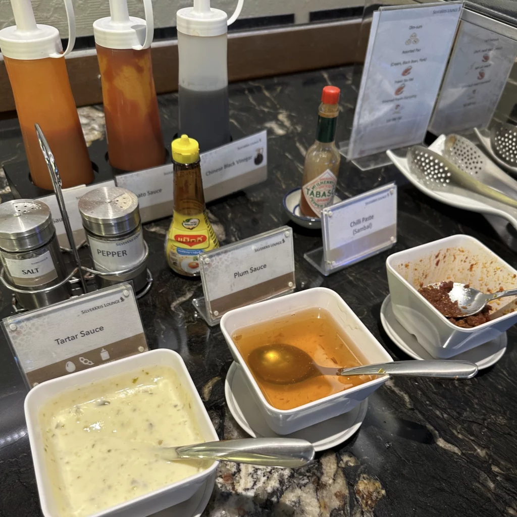The Singapore Airlines SilverKris Lounge in Bangkok Suvarnabhumi Airport has lots of condiments and sauces