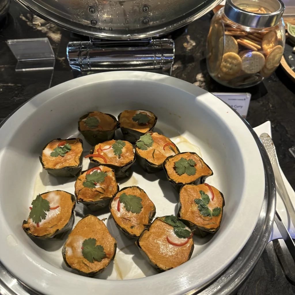 The Singapore Airlines SilverKris Lounge in Bangkok Suvarnabhumi Airport has steamed fish curry bites