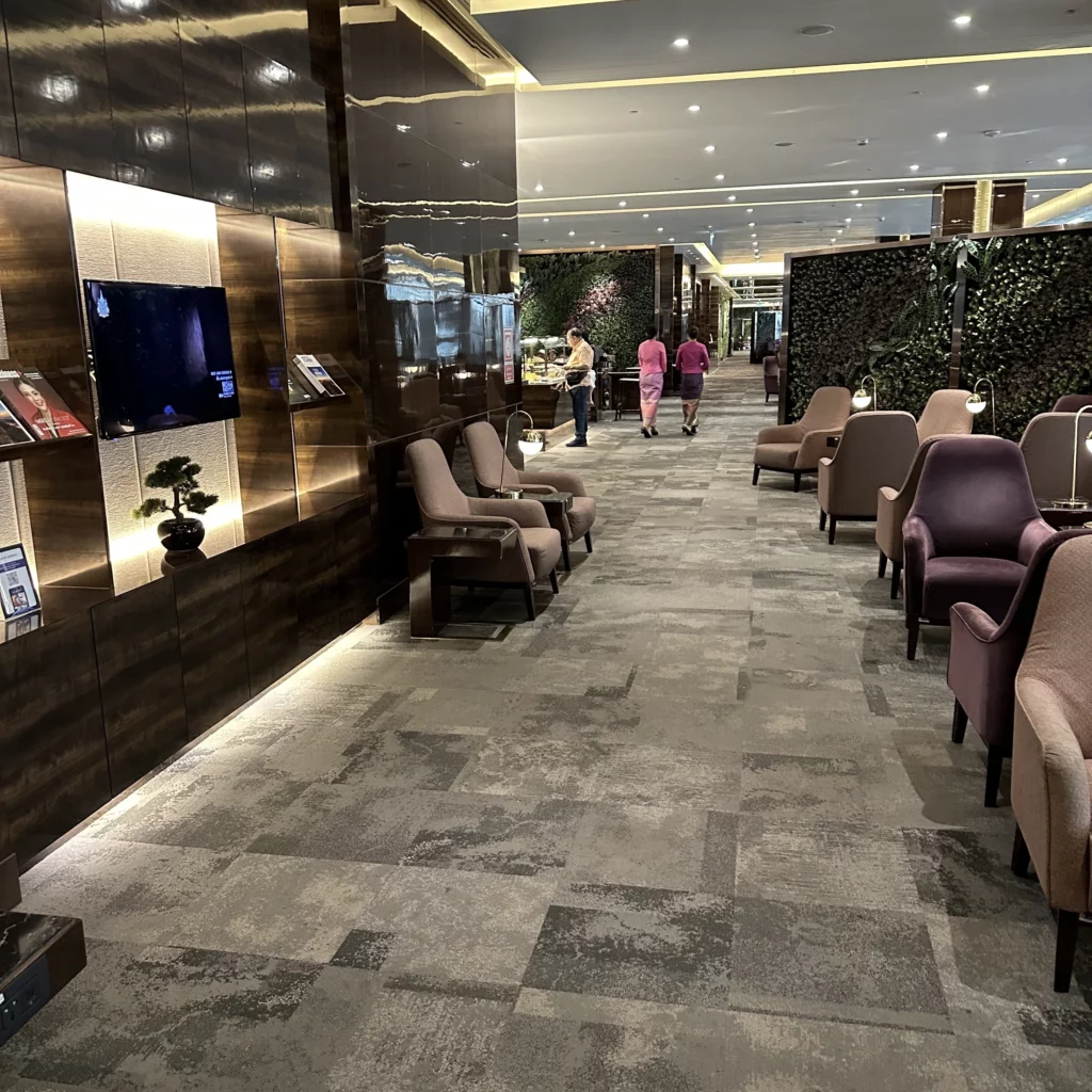 The Thai Airways Royal Orchid Prestige Business Class Lounge in Bangkok Suvarnabhumi Airport has a walkway down the middle of the lounge that splits it into two halves