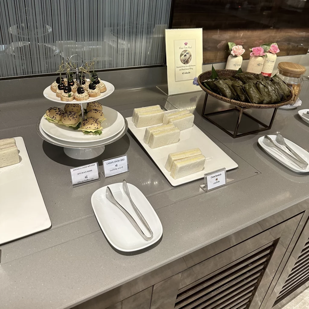 The Thai Airways Royal Orchid Prestige Business Class Lounge in Bangkok Suvarnabhumi Airport serves sandwiches and Thai desserts