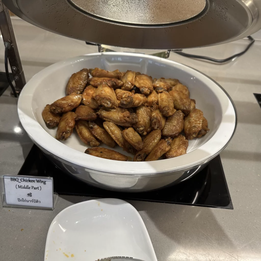 The Thai Airways Royal Orchid Prestige Business Class Lounge in Bangkok Suvarnabhumi Airport serves BBQ chicken wings